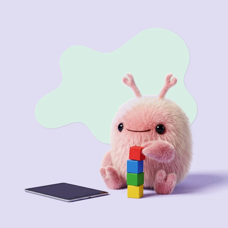 Cwab bouwt een torentje van blokken, de tablet ligt uit naast hem op de grond